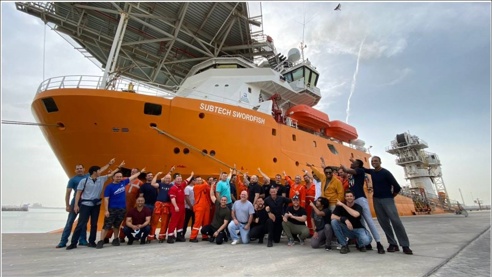 The James Fisher Subtech team stood in front of the Subtech Swordfish Offshore tug/Supply ship